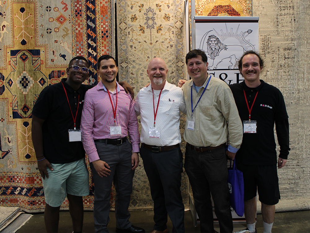 TRS: Ori Wilbush of S&H Rugs at center, with members of the S&H staff, along with rug industry veteran Darius Nemati of the Nemati Collection