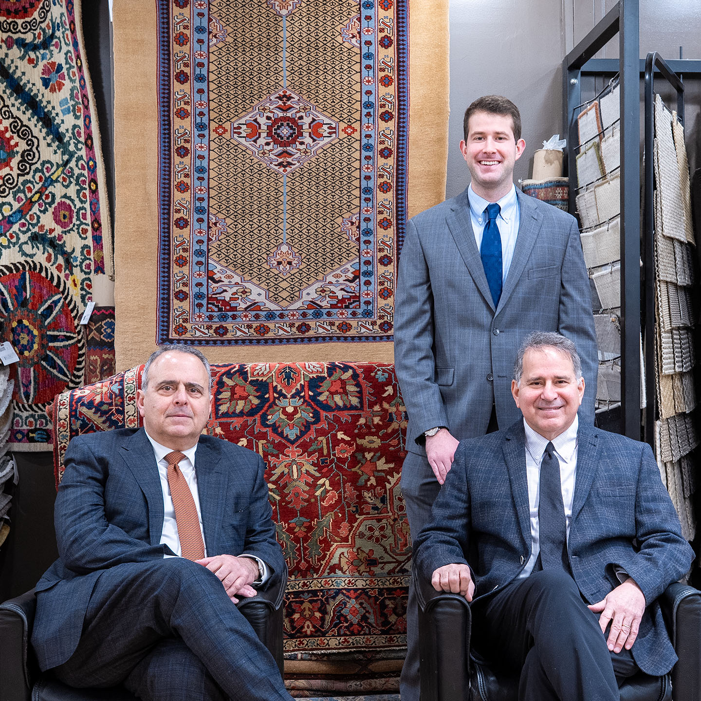 Marty Tatosian standing along with Oscar (left) and Sarkis Tatosian
